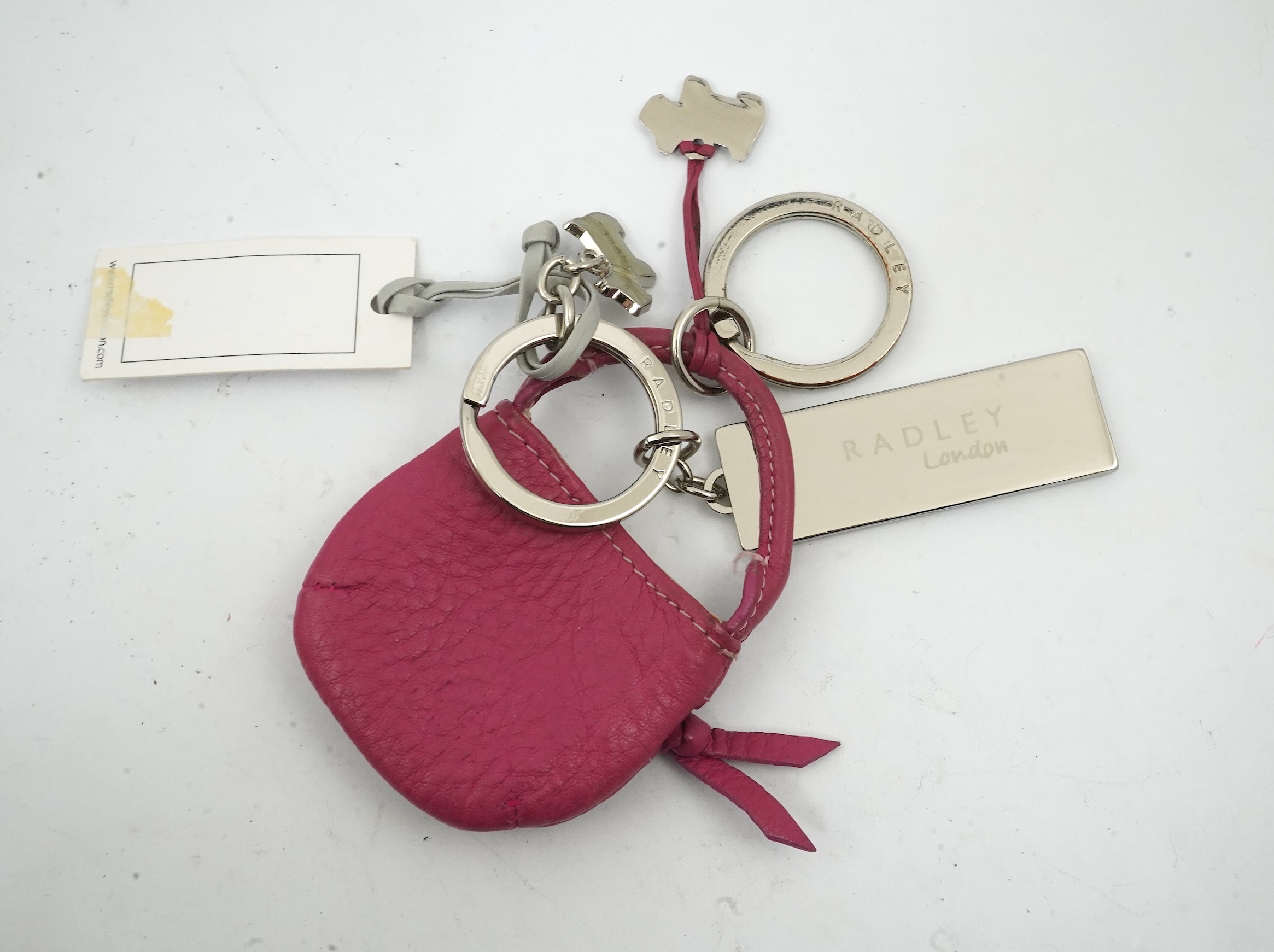 A Radley handbag, key fob and small bag.